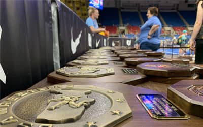 A row of champion stop signs laying on a table before the final championship bouts.