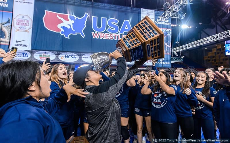 California celebrates their team title with by pretending to drink from the trophy cup