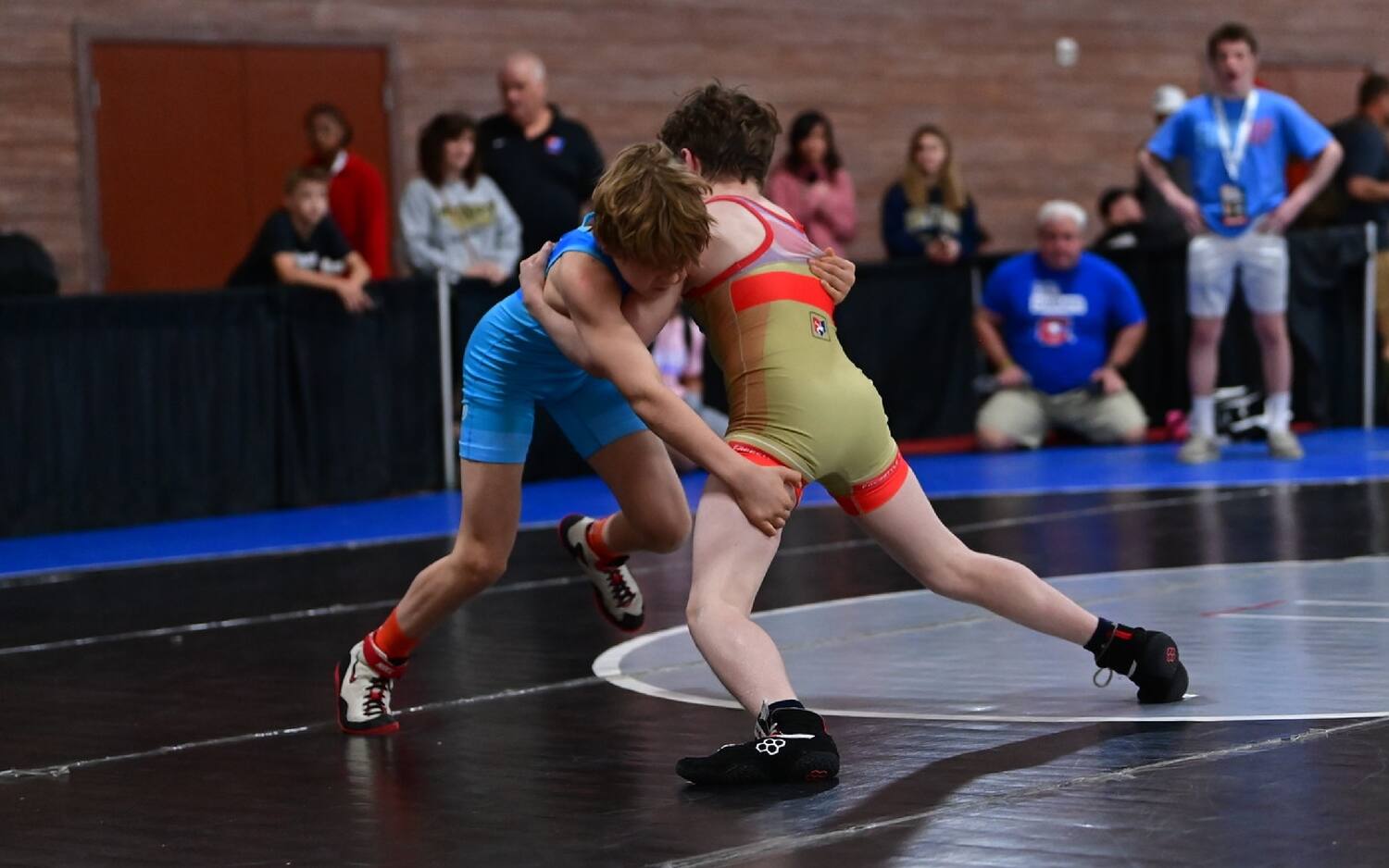 Two athletes fight in double over-under during the U15 Nationals