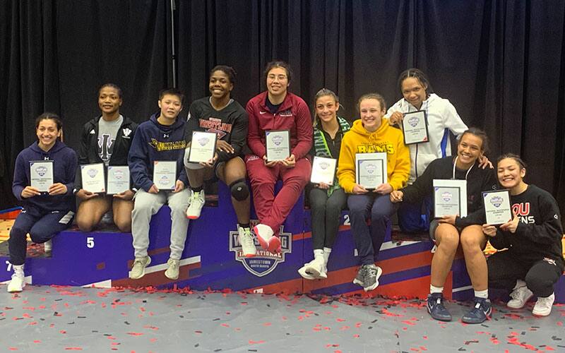 2022 NAIA Women's National Invitational champions pose together with their trophies