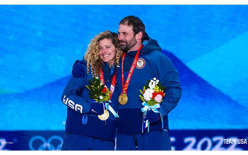 Nick Baumgartner and Lindsey Jacobellis of the USA, Olympic champions in mixed team snowboard cross, with their gold medals