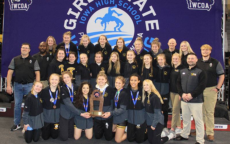 The Waverly-Shell Rock High School girls wrestling team poses after winning 2022 Iowa state team title.
