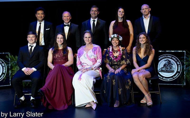 National Wrestling Hall of Fame Class of 2022 pose together at induction ceremony.