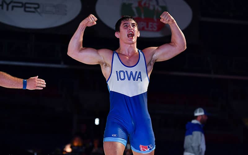 Wyatt Voelker (IA) flexes after winning the 2021 Junior Nationals in Greco-Roman 