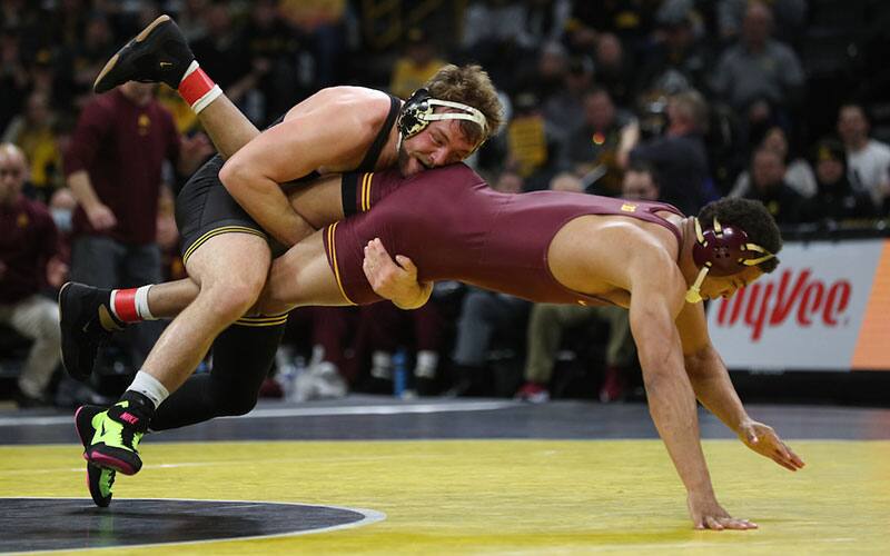 Jacob Warner (Iowa) scores a takedown in Minnesota dual