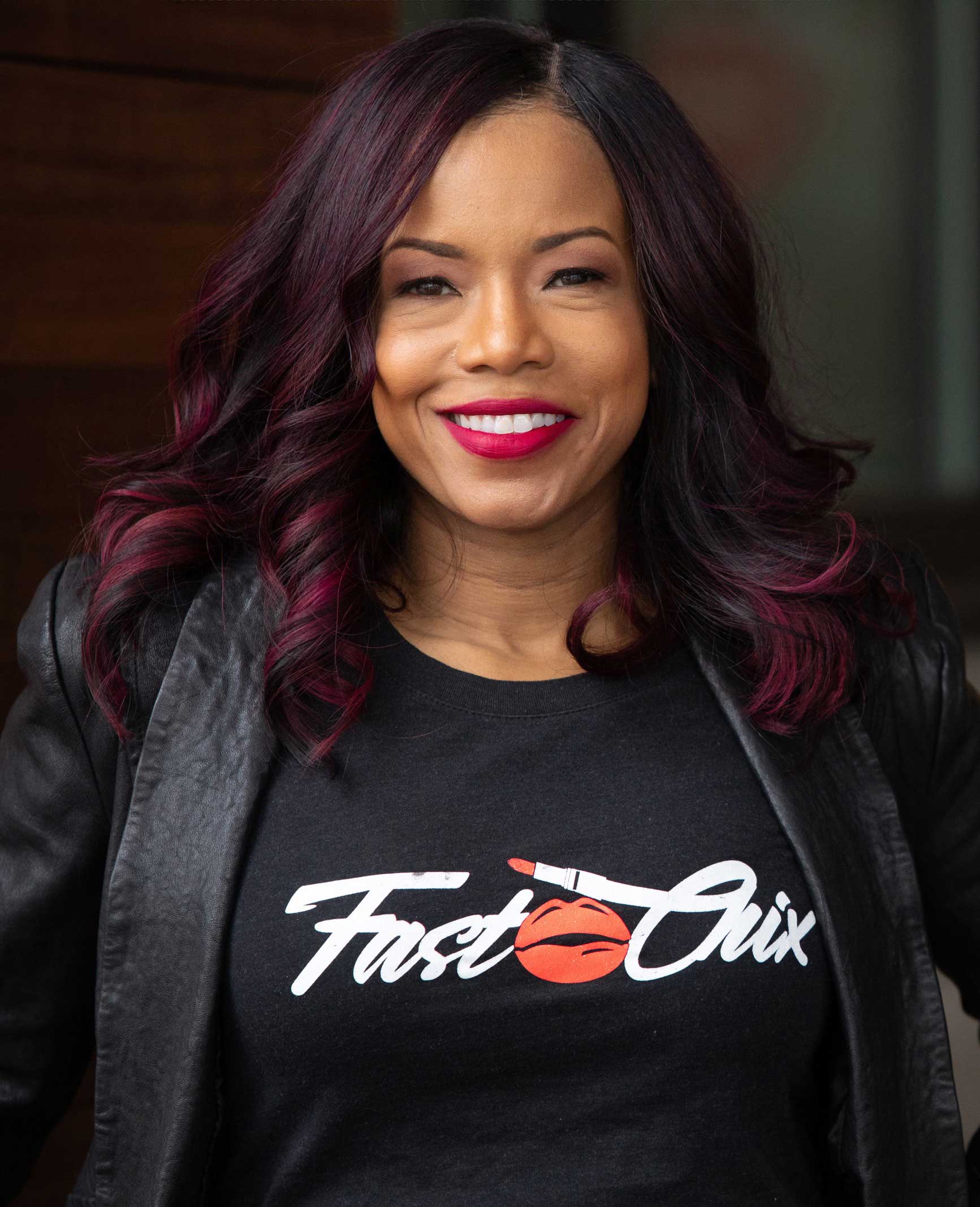 yvonne spencer smiling for a portrait photograph