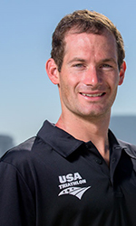 greg billington headshot wearing a black USA Triathlon polo